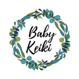 O Baby Keiki logo leaves in circle surrounding words Baby Keiki